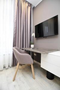 PLATINUM ROOMS butique hotel tesisinde bir televizyon ve/veya eğlence merkezi