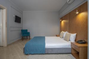 Posteľ alebo postele v izbe v ubytovaní Boomerang Boutique Hotel