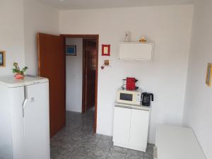 A cozinha ou cozinha compacta de Residencial Tranquilidade Florianopolis