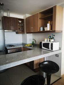 Dapur atau dapur kecil di Depto 1 Dormitorio Centro Blanco 702