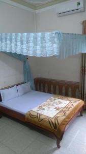 Cama ou camas em um quarto em Hoa Phuong Guesthouse