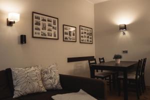 a living room with a couch and a table at athome IHR Apartment in Chemnitz