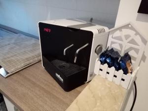 a black and white appliance sitting on top of a counter at L'Angolo Di San Pietro in Rome