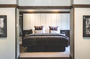 A bed or beds in a room at Gibbston Valley Lodge and Spa