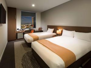 Cama ou camas em um quarto em ibis Brisbane Airport