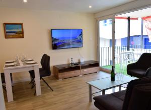 TV at/o entertainment center sa Apartment in Salou next to the beach for families,WIFI