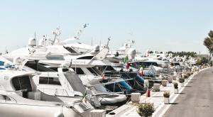 a bunch of boats are parked in a harbor at Porto Romano - The Marina Resort in Fiumicino