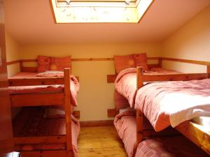 A bed or beds in a room at Killarney Railway Hostel