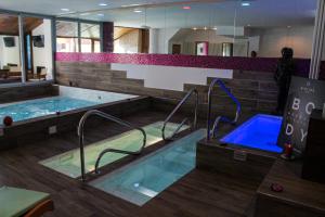 a large swimming pool in a building at Grand Hotel Sestriere in Sestriere