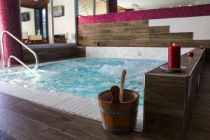 a large swimming pool with a red candle in it at Grand Hotel Sestriere in Sestriere