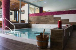 a swimming pool with a red candle and a red candle at Grand Hotel Sestriere in Sestriere