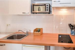 Dapur atau dapur kecil di Appartement des amoureux