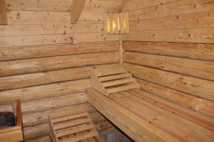 a log cabin with a sauna with wooden walls at Ferienhaus Wittmann in Kurort Oberwiesenthal