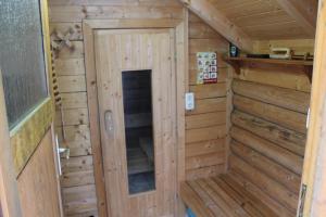 a wooden room with a door in a cabin at Ferienhaus Wittmann in Kurort Oberwiesenthal