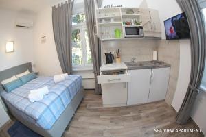 Cucina o angolo cottura di Apartments Morski Svet Portorož