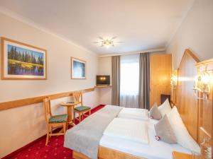 Кровать или кровати в номере Hotel Stegerbräu