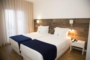 Voodi või voodid majutusasutuse Hotel Veleiro toas