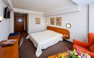 Cama ou camas em um quarto em Hotel Lux