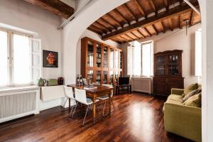 a living room with a table and a couch at The Galileo Apartment in Pisa