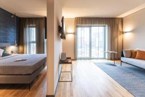 Tempat tidur dalam kamar di ipartment Frankfurt Airport