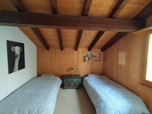 Llit o llits en una habitació de Chalet Bissetrot