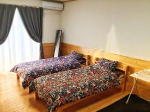 Krevet ili kreveti u jedinici u okviru objekta HIBARI GUESTHOUSE