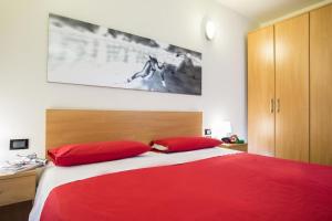 Una cama o camas en una habitación de Teleo Vacanze - Villaggio Olimpico di Sestriere