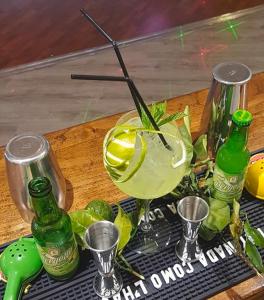 a wooden table with a drink in a glass at Hotel Atlantic in Arona