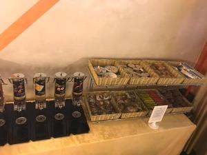 a table with several trays of different types of food at Hotel Atlantic in Arona