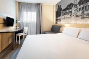 Postelja oz. postelje v sobi nastanitve B&B HOTEL Madrid Aeropuerto T1 T2 T3