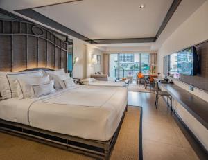 Tempat tidur dalam kamar di Riva Surya Bangkok