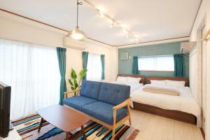 Кровать или кровати в номере Awaji Portside Holiday Home CHOUTA - Self Check-In Only