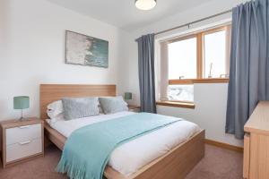 Gulta vai gultas numurā naktsmītnē Executive 3 Bed Apartment Aberdeen