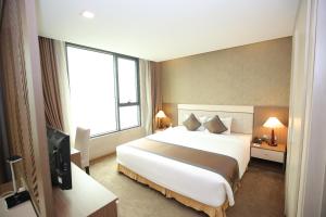 Muong Thanh Grand Thanh Hoa Hotel 객실 침대