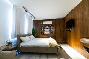 Una cama o camas en una habitación de צימר בוטיק אדלה Zimmer boutique adela