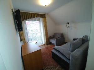 Televizors / izklaižu centrs naktsmītnē APARTAMENTY u KOWALA