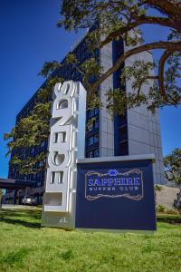 a hotel sign in front of a building at Hotel Legends in Biloxi