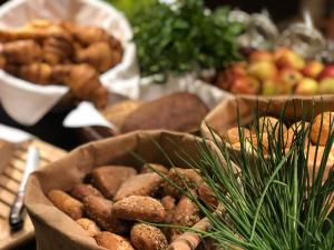 a table with a bunch of different types of food at Seminaris Hotel Lüneburg in Lüneburg