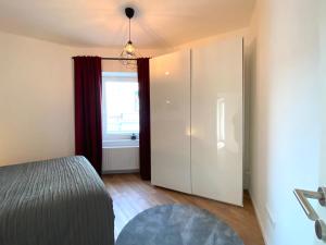 Postelja oz. postelje v sobi nastanitve White Inn - Ferienwohnung mit Terrasse