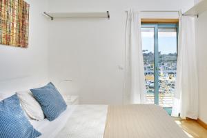 Llit o llits en una habitació de Casas Barulho Albufeira Marina