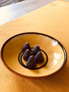 two chocolate covered cookies on a plate on a table at Evelyns Corner Duplex in Ghent