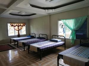 Mulu Diana Homestay में एक कमरे में एक या कई बेड