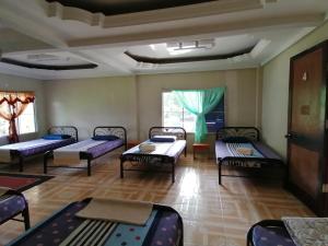 Mulu Diana Homestay में एक कमरे में एक या कई बेड