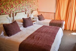 Cama ou camas em um quarto em Hotel & Apart Hotel Monte Verde