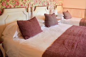 Cama ou camas em um quarto em Hotel & Apart Hotel Monte Verde