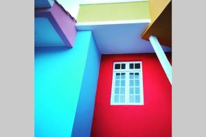 a house with a red door and a white window at NinePlace by LouzanPlace's in Lousã