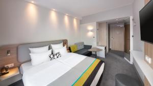 טלויזיה ו/או מרכז בידור ב-Holiday Inn Express Munich - City East, an IHG Hotel