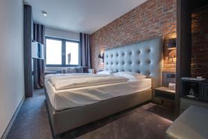 Кровать или кровати в номере Park Inn by Radisson Lübeck