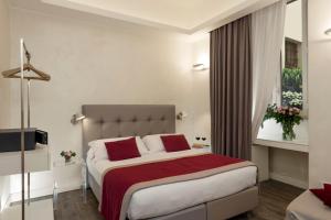 A bed or beds in a room at Hotel Navona