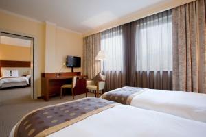 Holiday Inn Salerno-Cava De' Tirreni by IHG में एक कमरे में एक या कई बेड